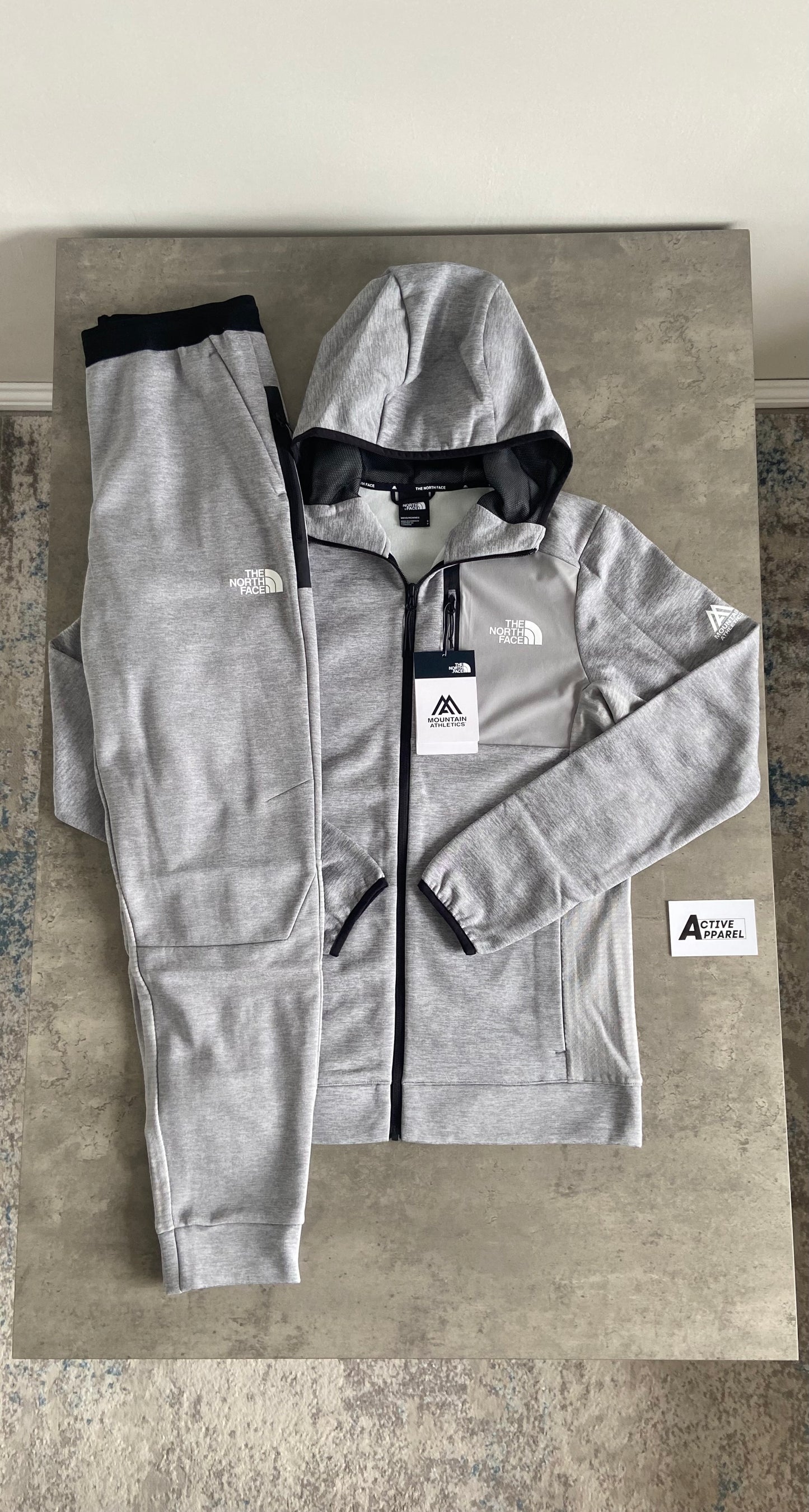 THE NORTH FACE MOUNTAIN ATHLETICS TRACKSUIT - GREY