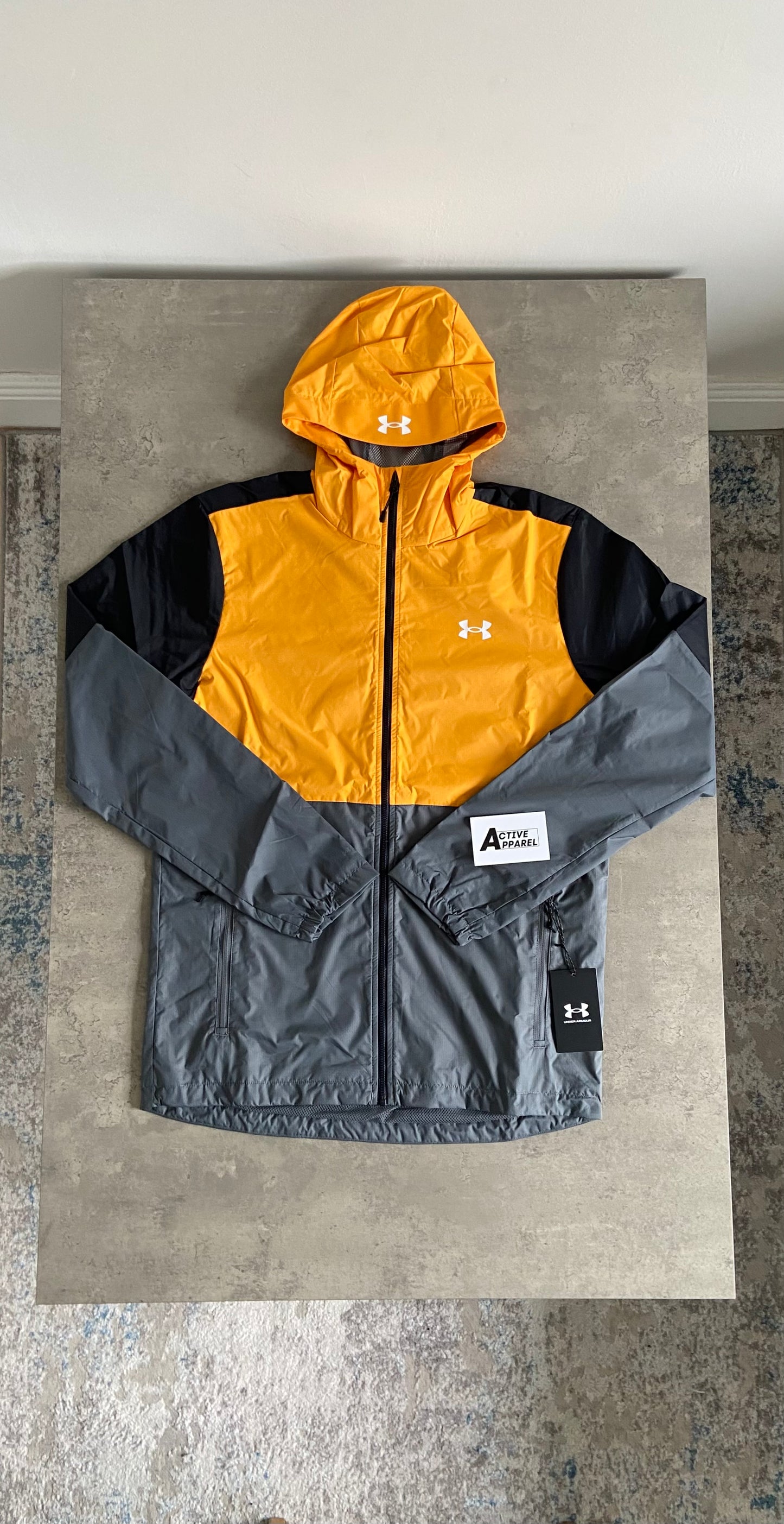 UNDER ARMOUR WINDBREAKER - ORANGE/GREY