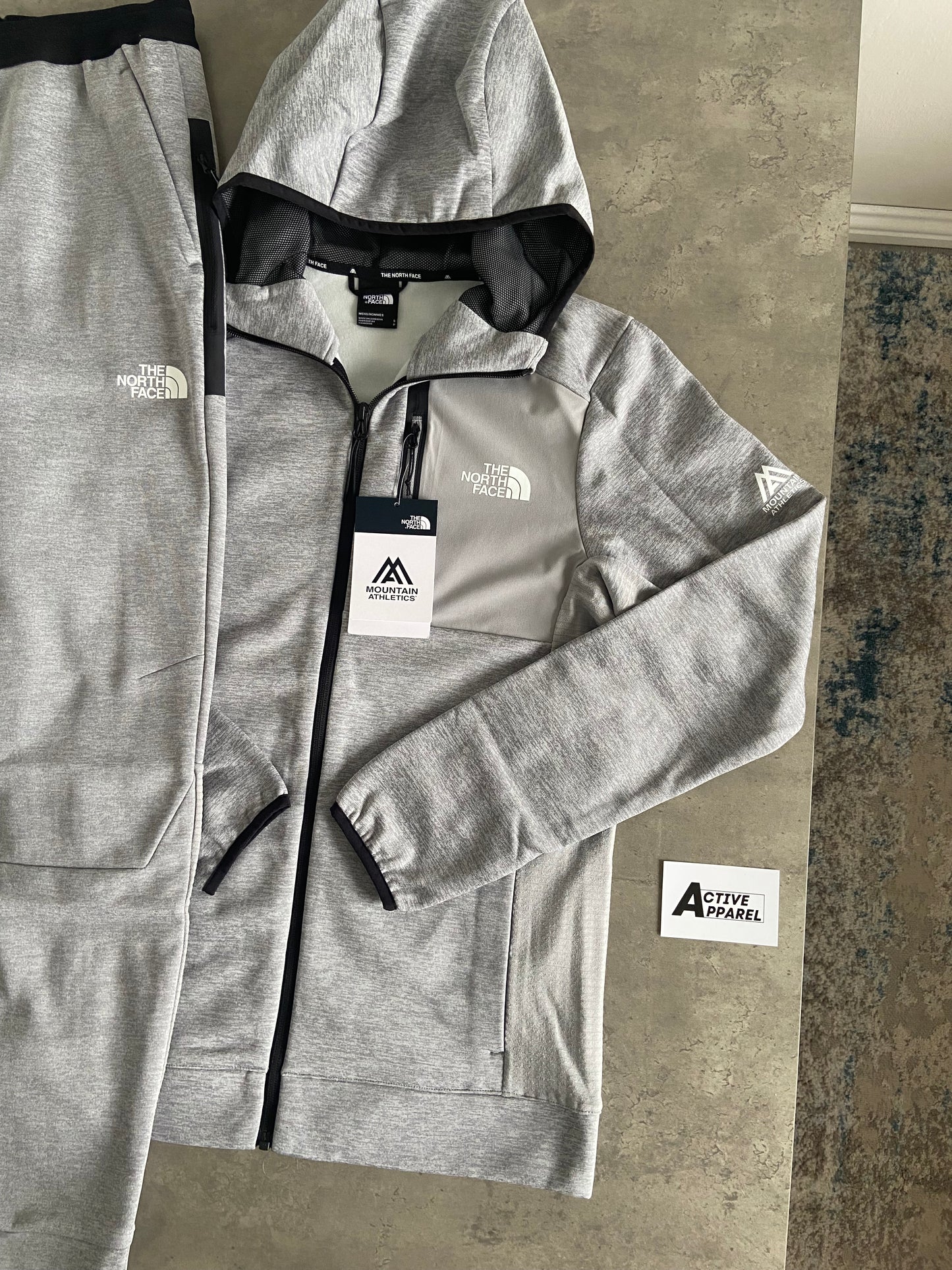 THE NORTH FACE MOUNTAIN ATHLETICS TRACKSUIT - GREY