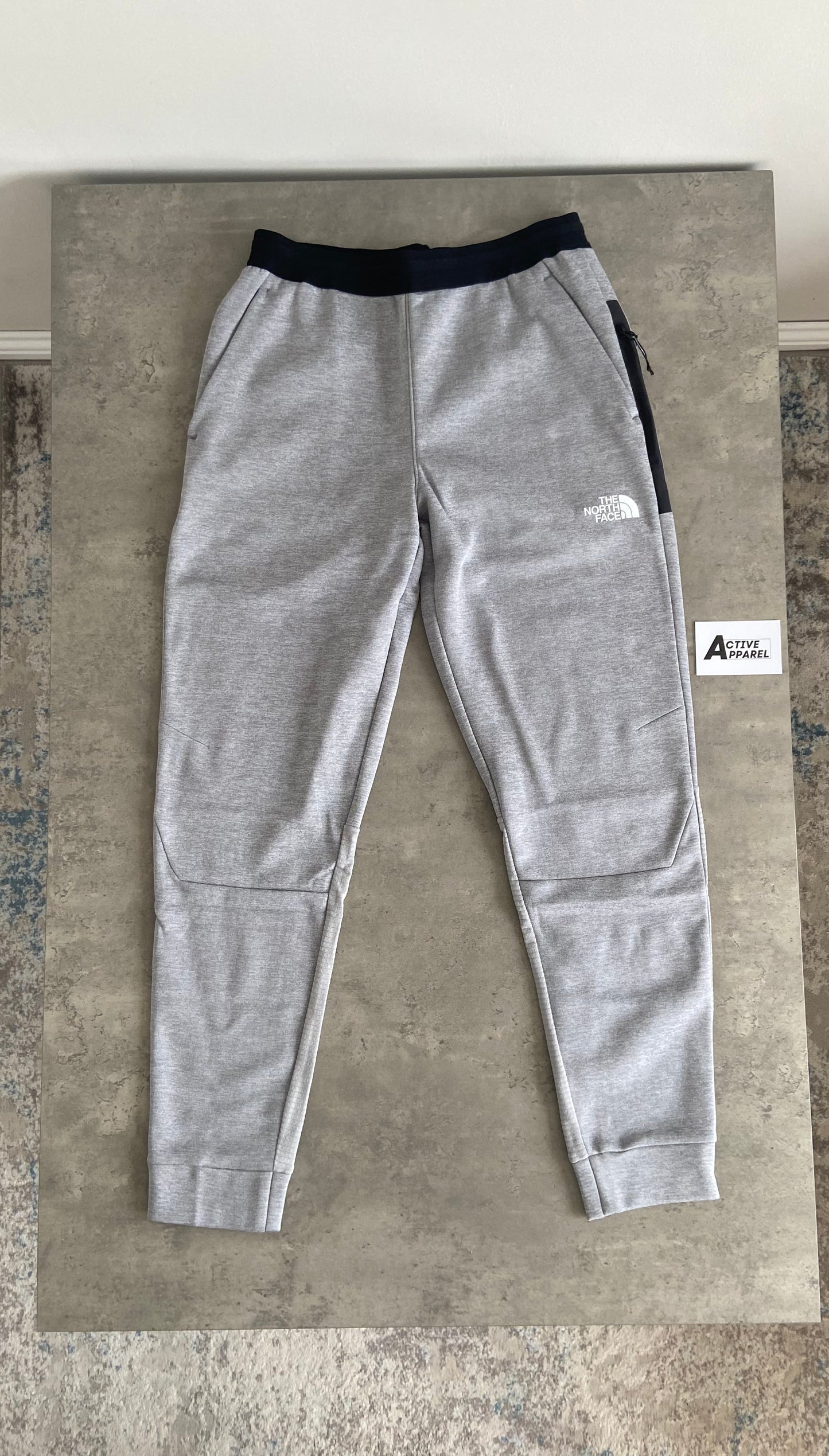 THE NORTH FACE MOUNTAIN ATHLETICS TRACKSUIT - GREY